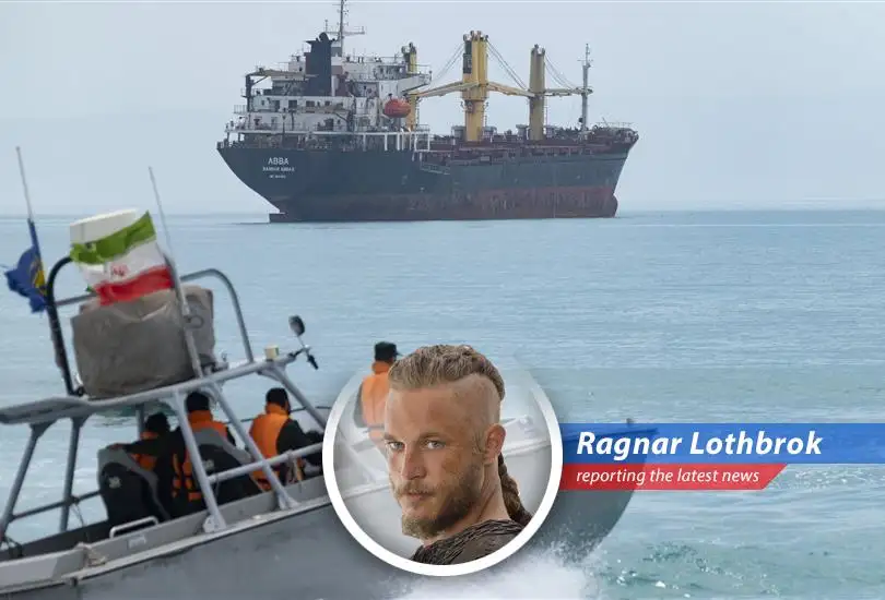 A US Navy ship navigating the Strait of Hormuz amidst rising tensions between the US and Iran.