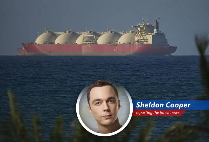 A cargo ship navigates the Strait of Hormuz under tentative conditions.