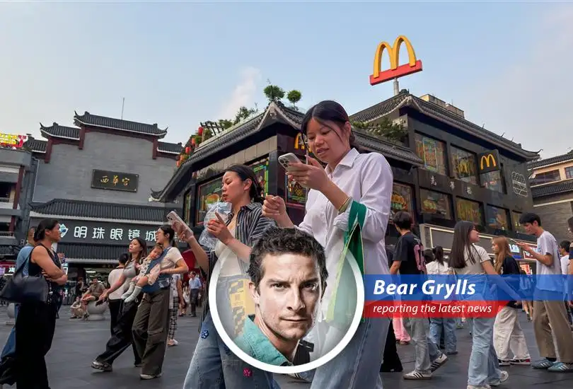 A customer enjoys a McDonald's milkshake at the newly opened McDonaldland store in Beijing's Chaoyang Park.