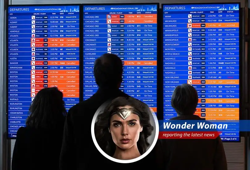 A snow-covered airplane sits grounded at an airport amidst widespread flight cancellations due to a severe winter storm.