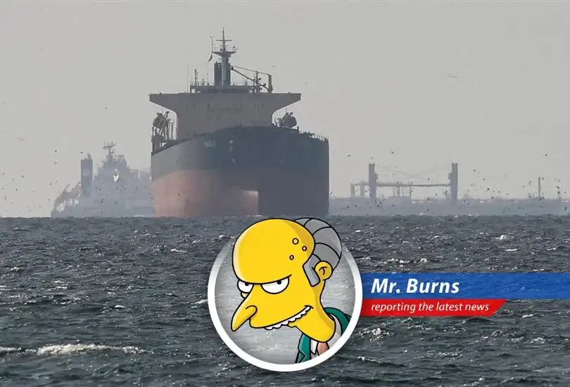 A tanker navigates the Strait of Hormuz, a waterway potentially subject to new Iranian tolls, as seen from my private Gulfstream.