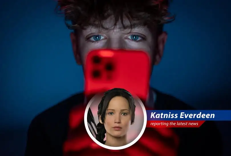 A teenager stares at a phone screen, symbolizing the battle for attention in the digital age and the UK's pilot program restricting social media use.