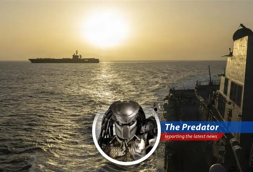 Cargo ship navigating the Strait of Hormuz, a critical global oil and gas transit route.