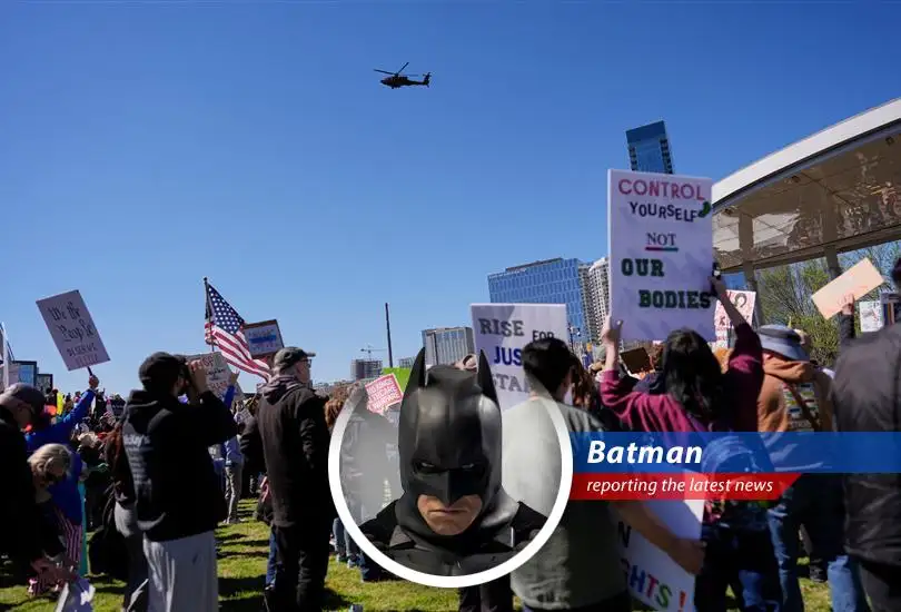 Kid Rock salutes Apache helicopters during controversial flyby.