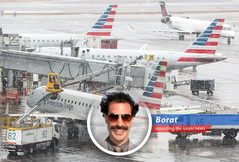 Snow blankets a grounded airplane at a major East Coast airport, symbolizing widespread flight cancellations due to a severe blizzard.