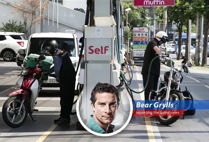 South Korean gas station amidst rising fuel prices, prompting government intervention.