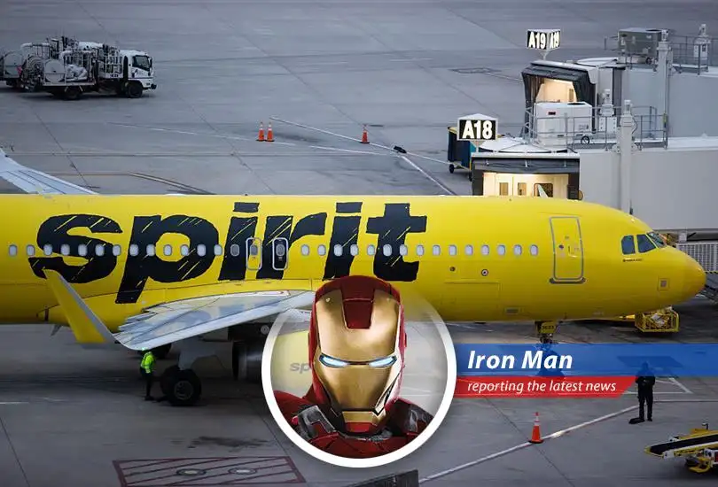 Spirit Airlines aircraft at an airport gate symbolizing fleet adjustments amid financial restructuring.