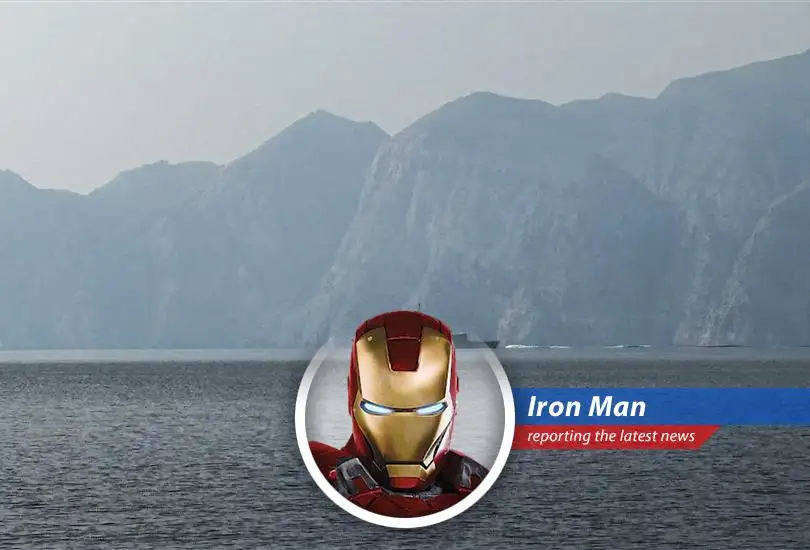 U.S. Navy ships patrol the Strait of Hormuz, enforcing the blockade on Iranian ports.