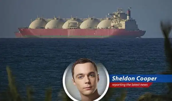 A cargo ship navigates the Strait of Hormuz under tentative conditions.