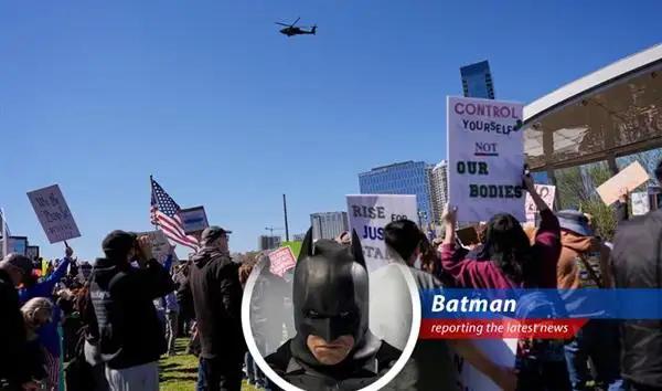Kid Rock salutes Apache helicopters during controversial flyby.