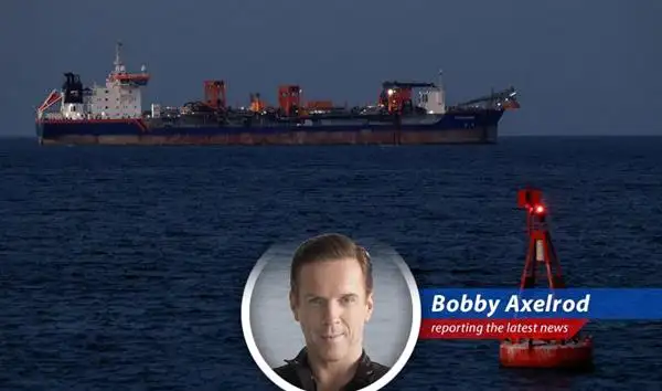 Oil tanker navigating the Strait of Hormuz, a critical choke point for global energy supplies.