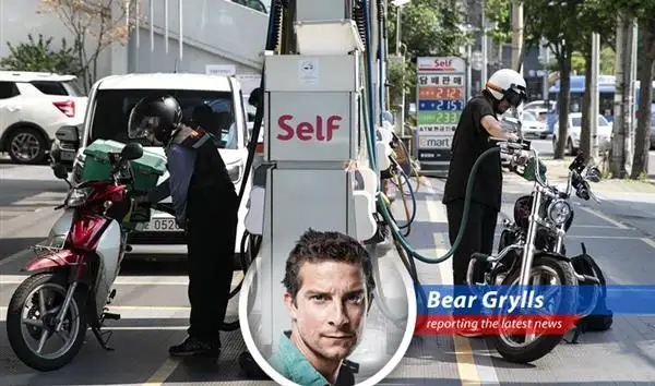 South Korean gas station amidst rising fuel prices, prompting government intervention.