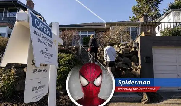 Spider-Man perched atop a skyscraper, overlooking a city struggling with housing market challenges.