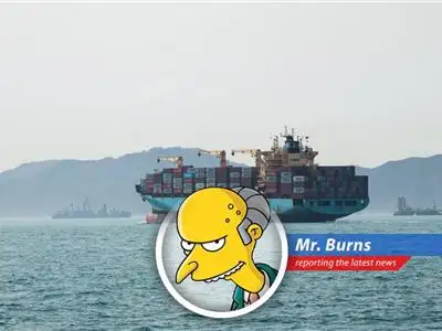 A Maersk vessel escorted by the U.S. Navy transits the Strait of Hormuz.