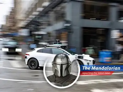 A Waymo robotaxi navigating city streets highlighting the debate between technological advancement and public safety concerns.