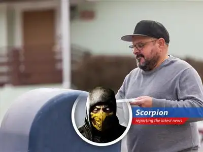 A close-up of a letter being dropped into a USPS mailbox, highlighting the potential postmarking delays.