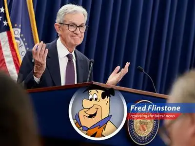 A frustrated Fred Flintstone ponders his financial future amidst rising inflation and stalled interest rate cuts.