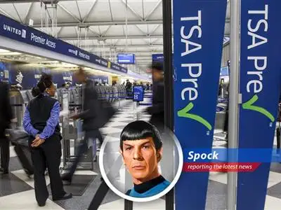 Airport security lines at a major hub. The averted suspension of PreCheck offers a temporary respite for travelers.