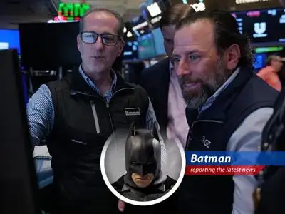 Batman overlooking Gotham's financial district, ensuring fair play and market stability.