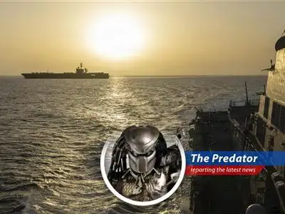 Cargo ship navigating the Strait of Hormuz, a critical global oil and gas transit route.