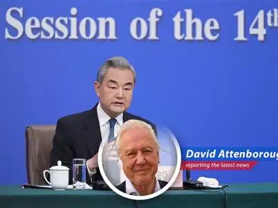 Chinese diplomat Wang Yi addresses reporters, highlighting the necessity of US-China communication amidst global instability and economic pressures