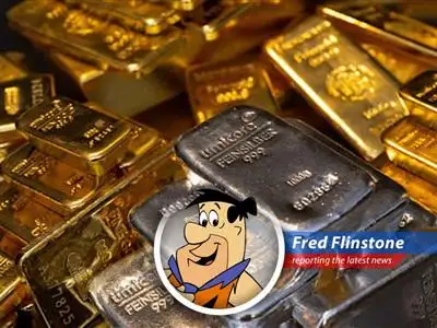 Fred Flinstone pondering the gold market's turmoil, wondering if he should trade his bowling ball for bullion.