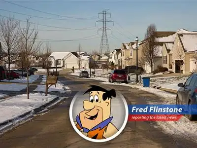 Fred Flinstone staring at an electricity bill, realizing even bedrock budgets can't handle AI's power-hungry appetite.