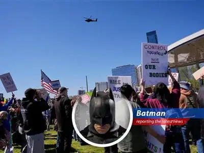 Kid Rock salutes Apache helicopters during controversial flyby.