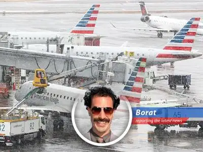Snow blankets a grounded airplane at a major East Coast airport, symbolizing widespread flight cancellations due to a severe blizzard.