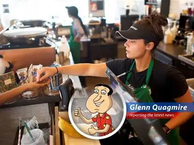 Starbucks barista prepares a customer's order. The company's new bonus program aims to motivate employees and enhance customer experience.