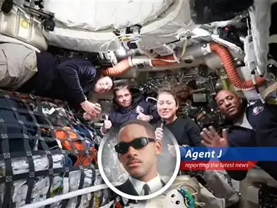 The Artemis II crew, including Reid Wiseman, Jeremy Hansen, Victor Glover, and Christina Koch, celebrate breaking Apollo 13's distance record during their lunar flyby.