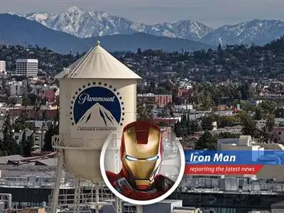 Warner Bros. Discovery's headquarters amidst merger speculation. Tony Stark analyzes the business strategy from a technological perspective.