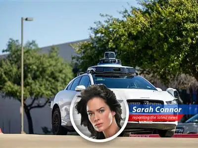 Waymo robotaxi navigates city streets before recall announcement.